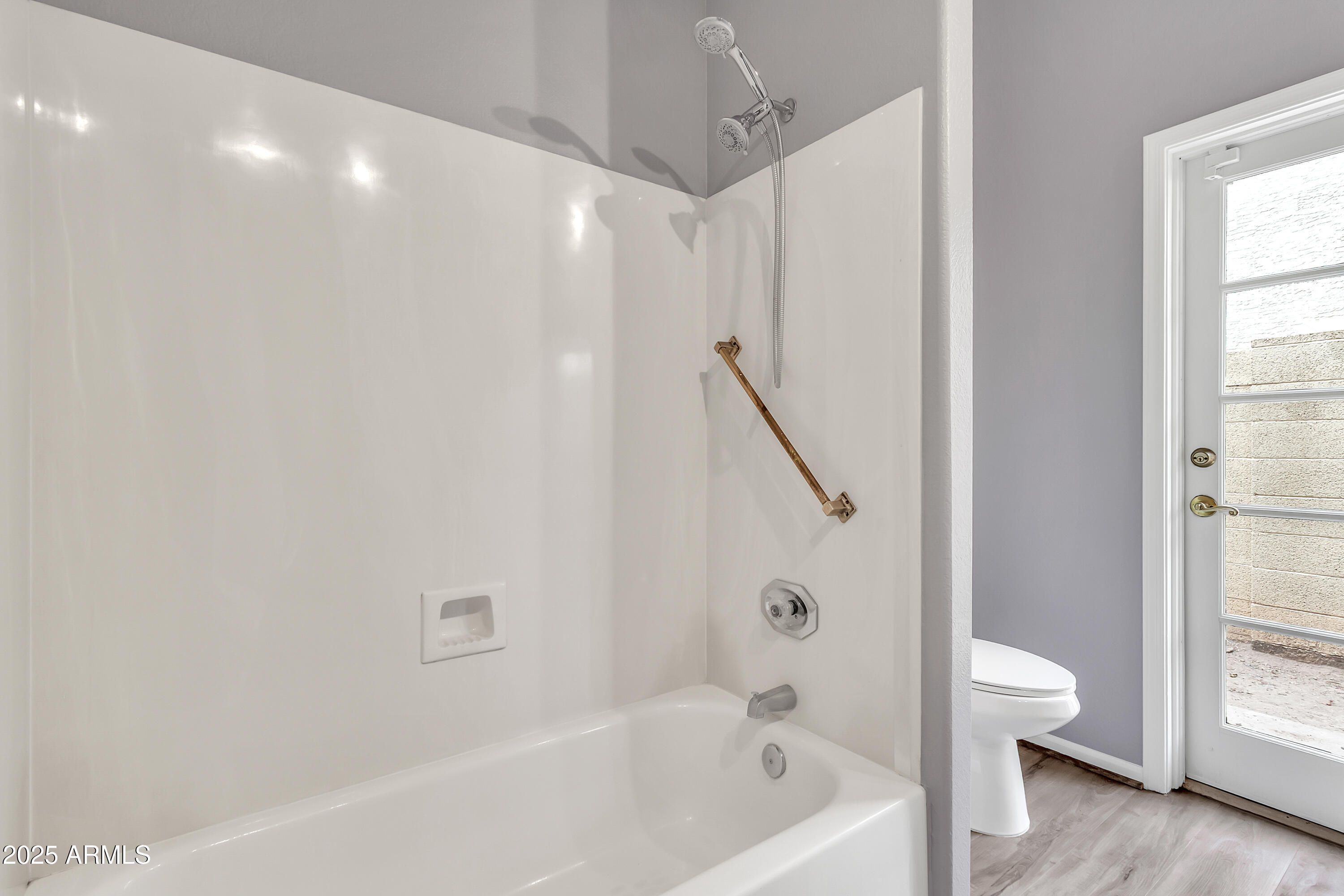 205 East Stacey Lane Tempe, AZ 85284 - Photo 25 of 63 a bathroom with a bathtub and a shower