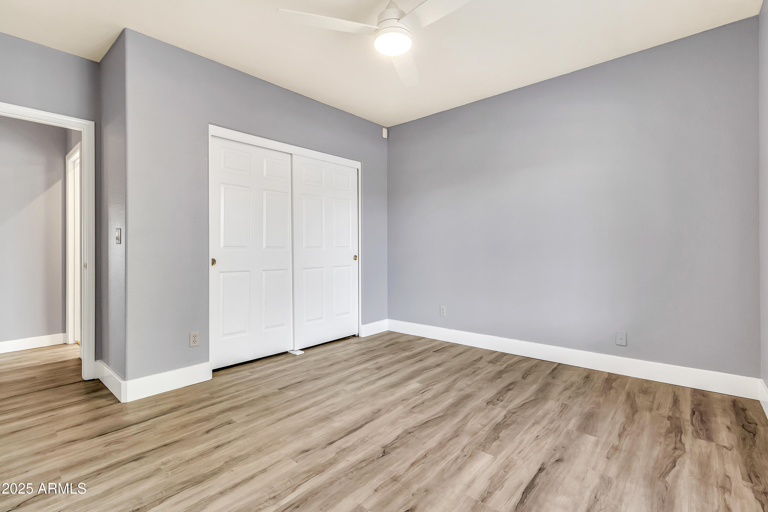205 East Stacey Lane Tempe, AZ 85284 - Photo 27 of 63 a view of an empty room with wooden floor and closet