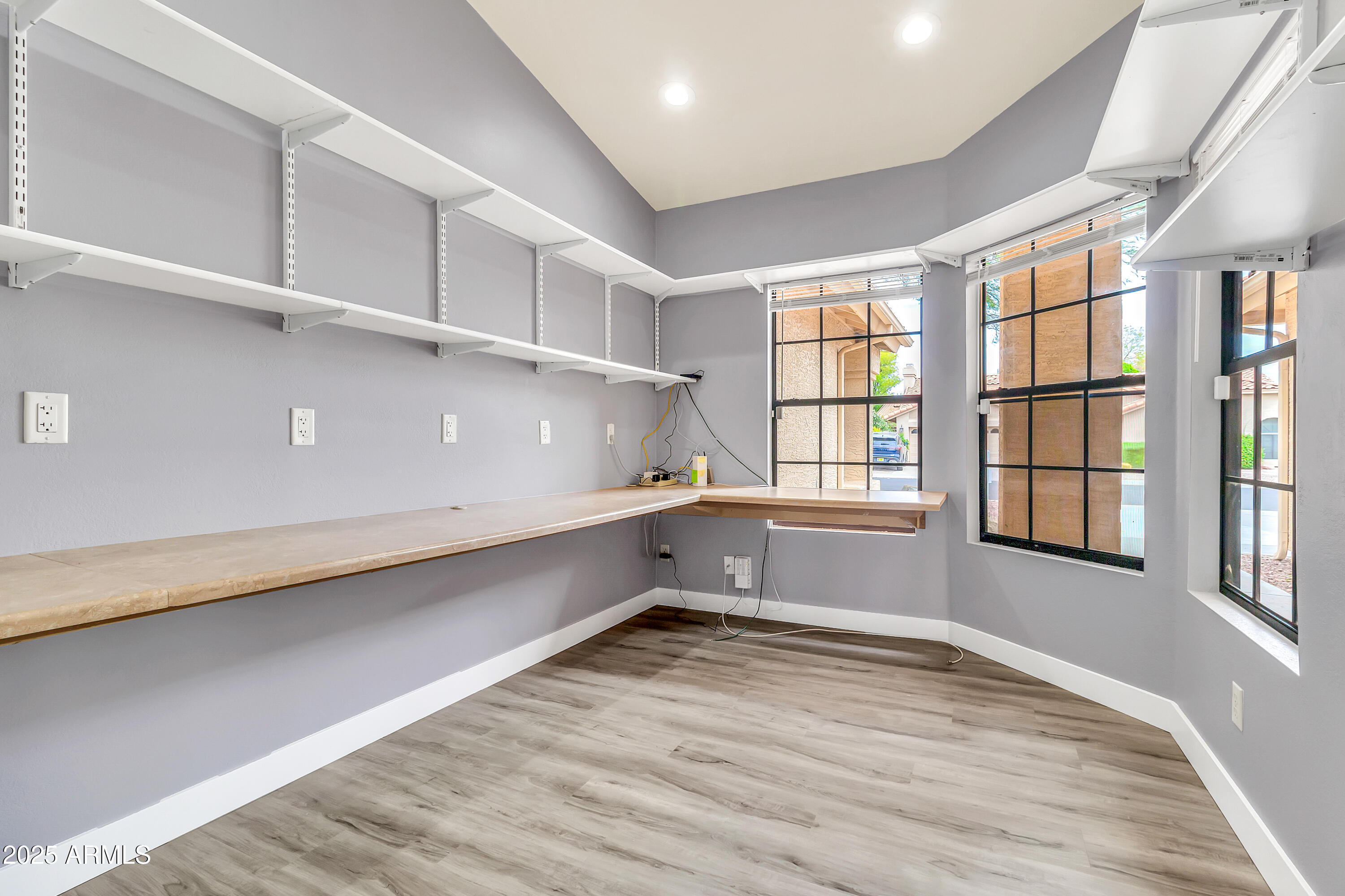205 East Stacey Lane Tempe, AZ 85284 - Photo 36 of 63 an empty room with wooden floor and windows