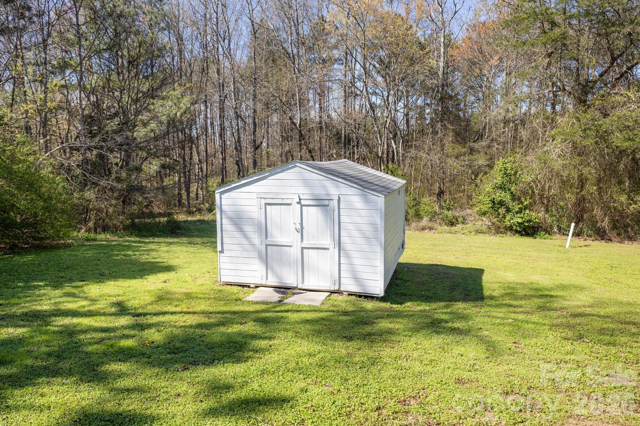 1012 Crescent Way Wingate, NC 28174 - Photo 18 of 20 a view of a tiny house with a yard