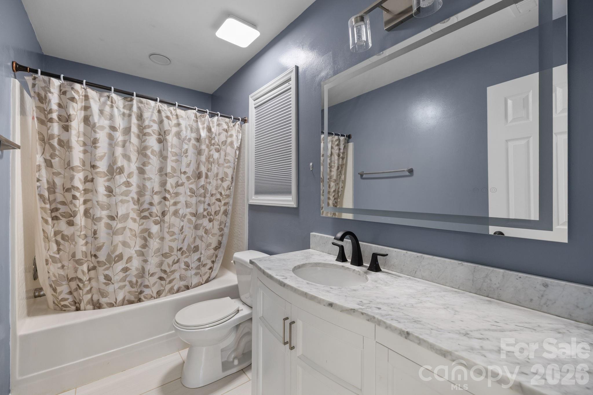 1012 Crescent Way Wingate, NC 28174 - Photo 10 of 20 a bathroom with a granite countertop sink toilet and shower