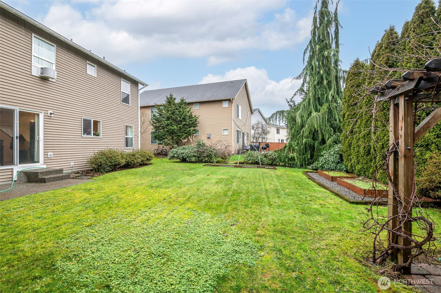 17008 Southeast 183rd Place Renton, WA 98058 - Photo 24 of 27 a view of backyard of house with green space
