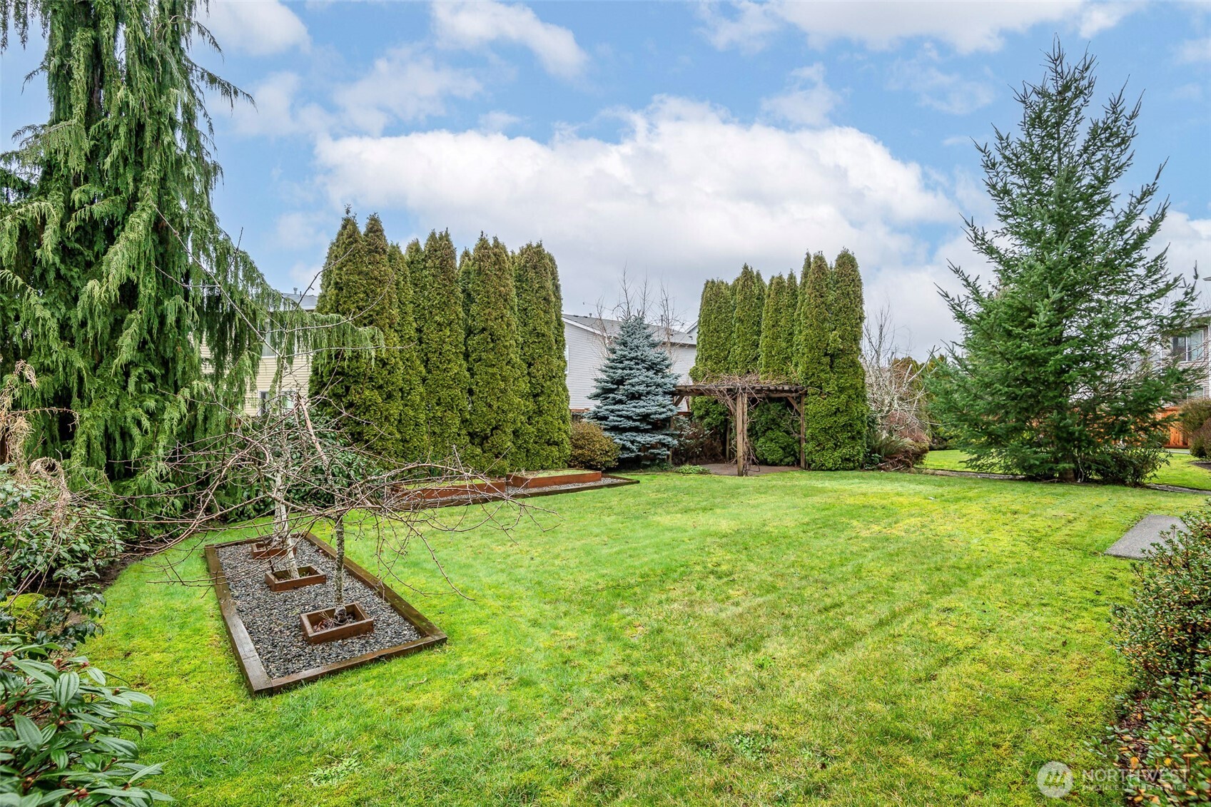 17008 Southeast 183rd Place Renton, WA 98058 - Photo 25 of 27 a view of a yard with a house in the background