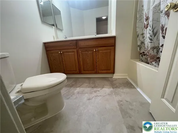 a bathroom with a toilet and a sink