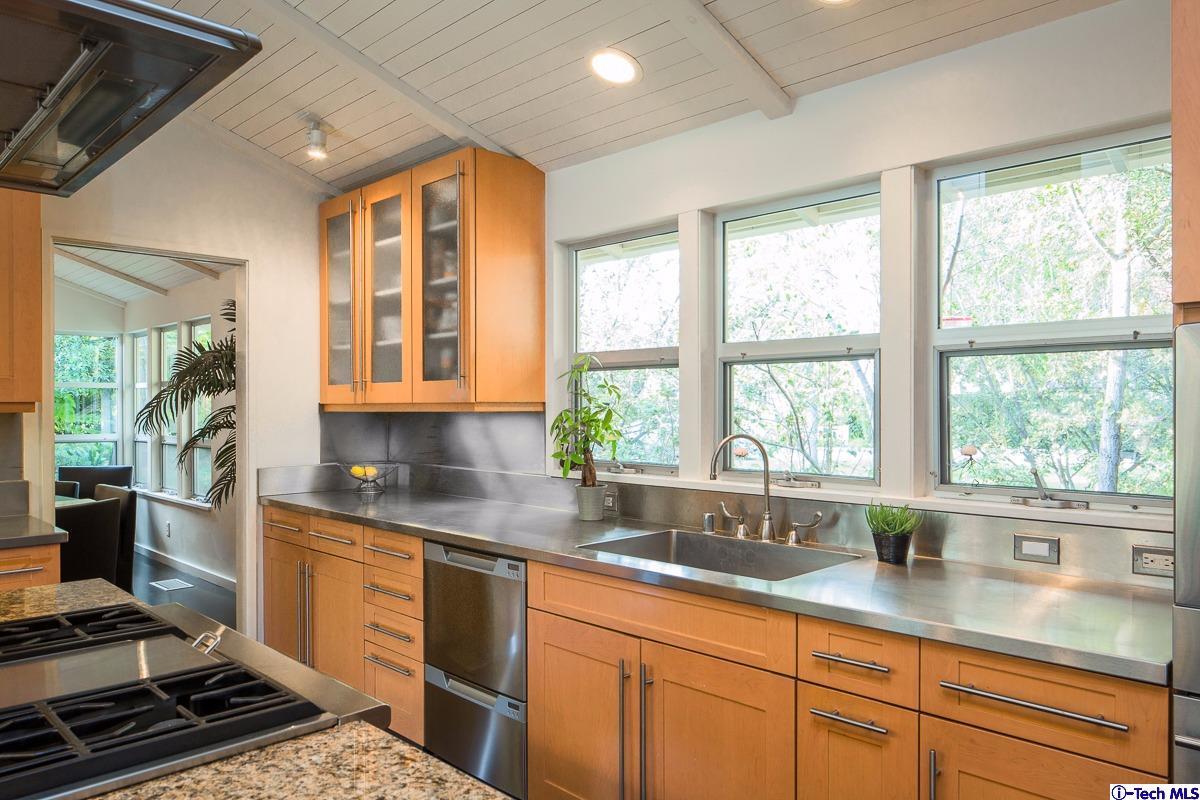 900 Hillcrest Place Pasadena, CA 91106 - Photo 12 of 40 a kitchen with granite countertop a sink and a window