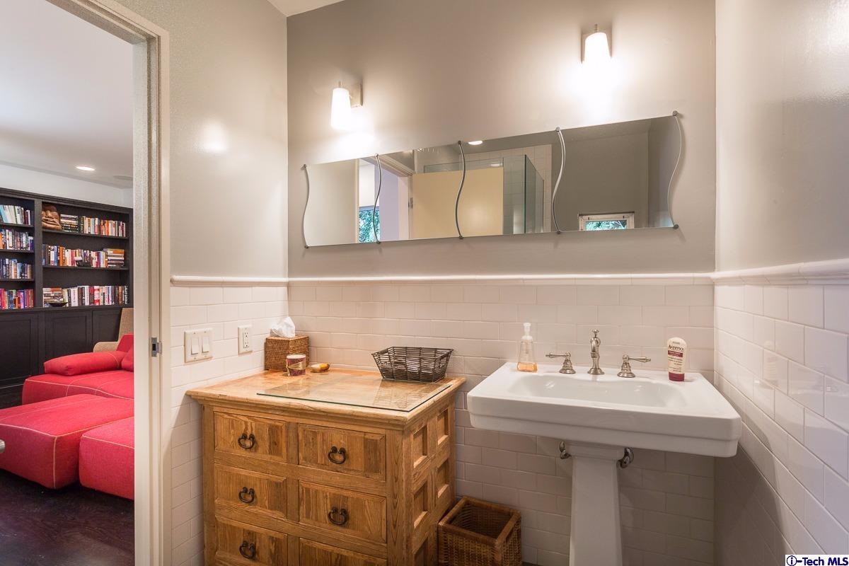 900 Hillcrest Place Pasadena, CA 91106 - Photo 18 of 40 a bathroom with a sink vanity and mirror