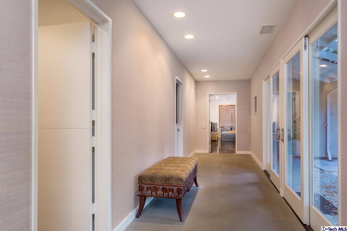 900 Hillcrest Place Pasadena, CA 91106 - Photo 19 of 40 a living room with a bed and a table with closet