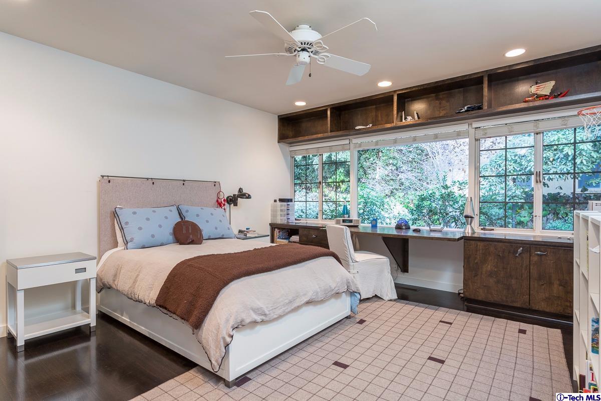 900 Hillcrest Place Pasadena, CA 91106 - Photo 20 of 40 a bedroom with a large bed and a large window