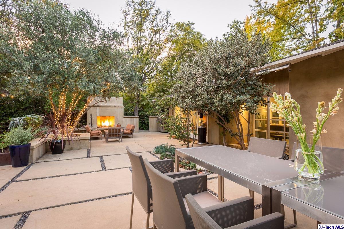 900 Hillcrest Place Pasadena, CA 91106 - Photo 29 of 40 a view of a patio with table and chairs and potted plants