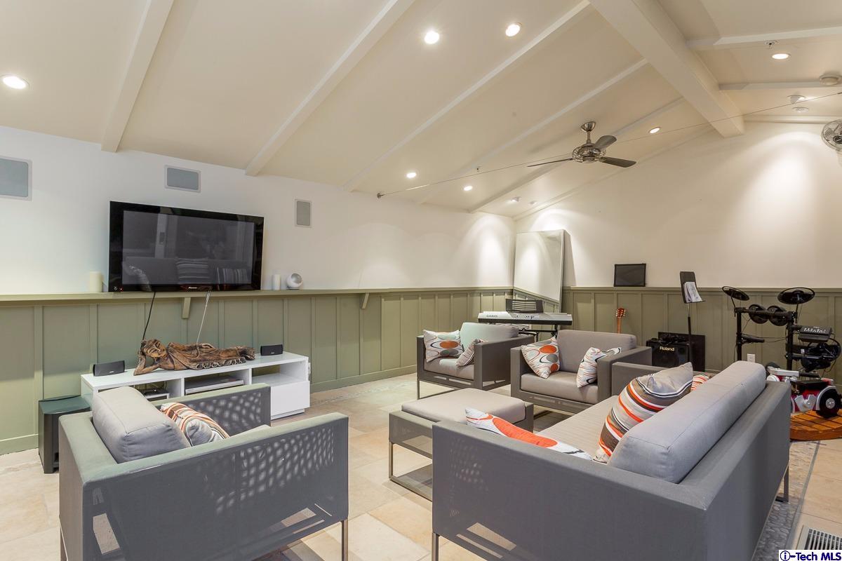 900 Hillcrest Place Pasadena, CA 91106 - Photo 35 of 40 a living room with furniture and a flat screen tv