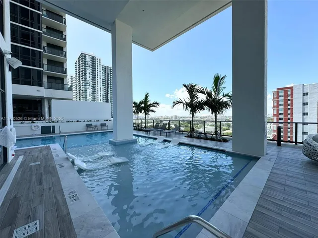 a view of a living room and staircase with wooden floor