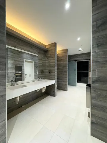 a view of room with large window and walk in closet