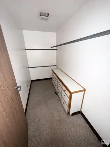 a view of a hallway with stairs