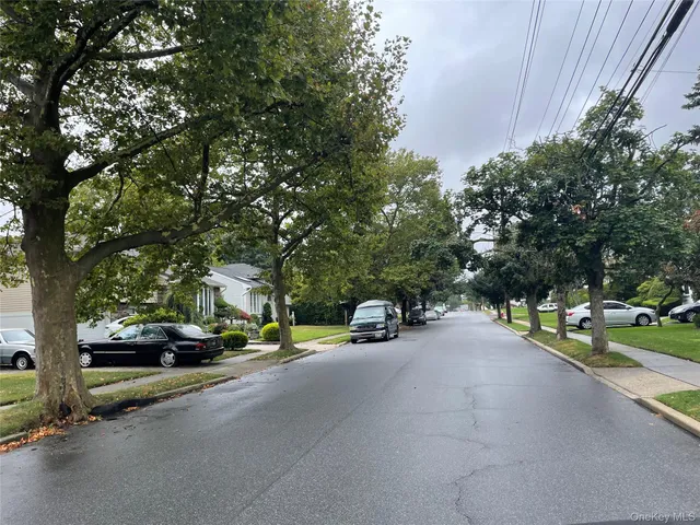 a view of a street with cars