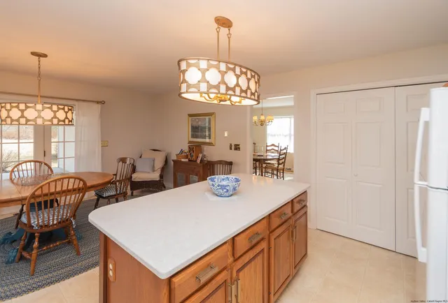 a view of a dining room with furniture and window
