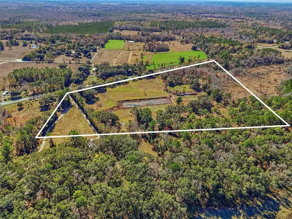 an aerial view of residential house with outdoor space