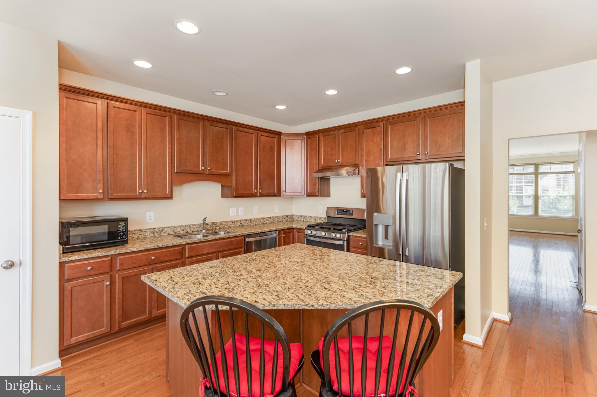 97 Short Branch Road Stafford, VA 22556 - Photo 8 of 26 Modern kitchen with elegant wood cabinetry.