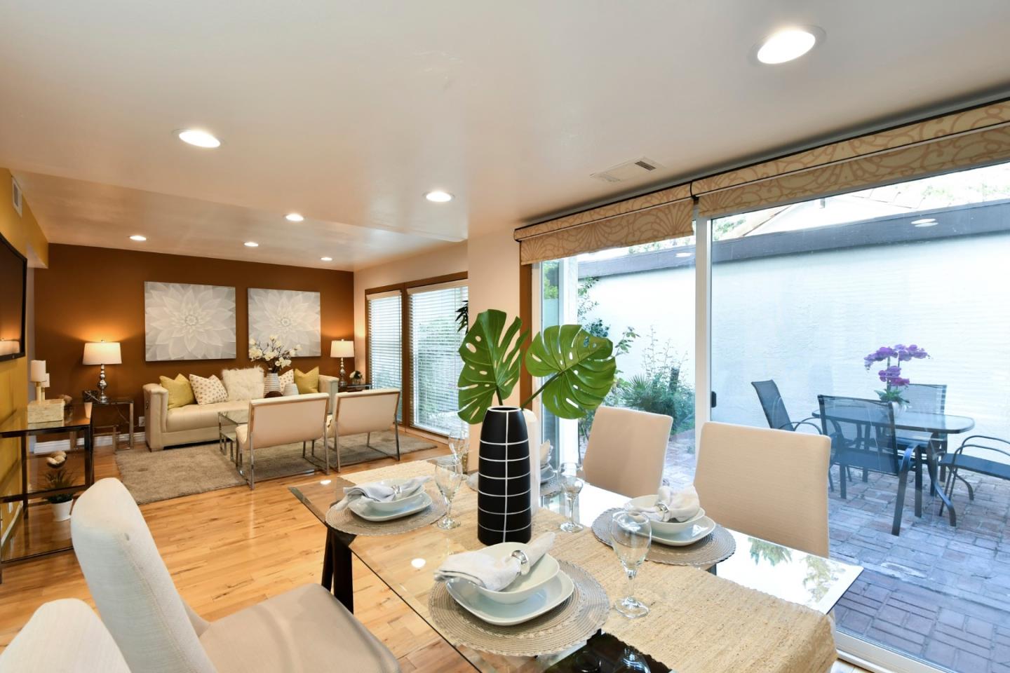 22059 McClellan Road Cupertino, CA 95014 - Photo 12 of 40 a living room with furniture and a wooden floor