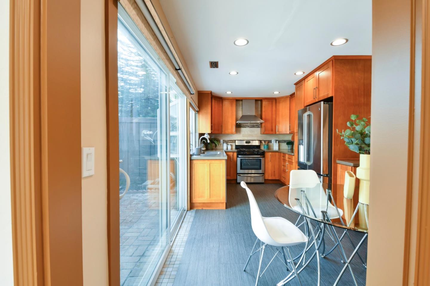 22059 McClellan Road Cupertino, CA 95014 - Photo 13 of 40 a dining room filled counter top space a refrigerator and furniture