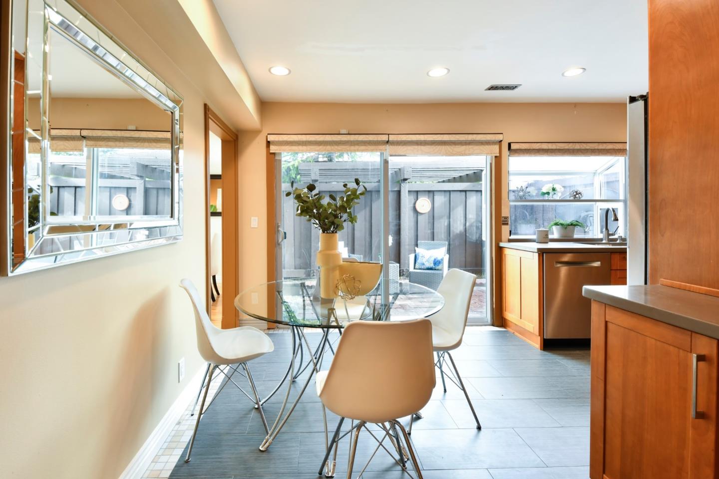 22059 McClellan Road Cupertino, CA 95014 - Photo 15 of 40 a dining room with furniture and a large window