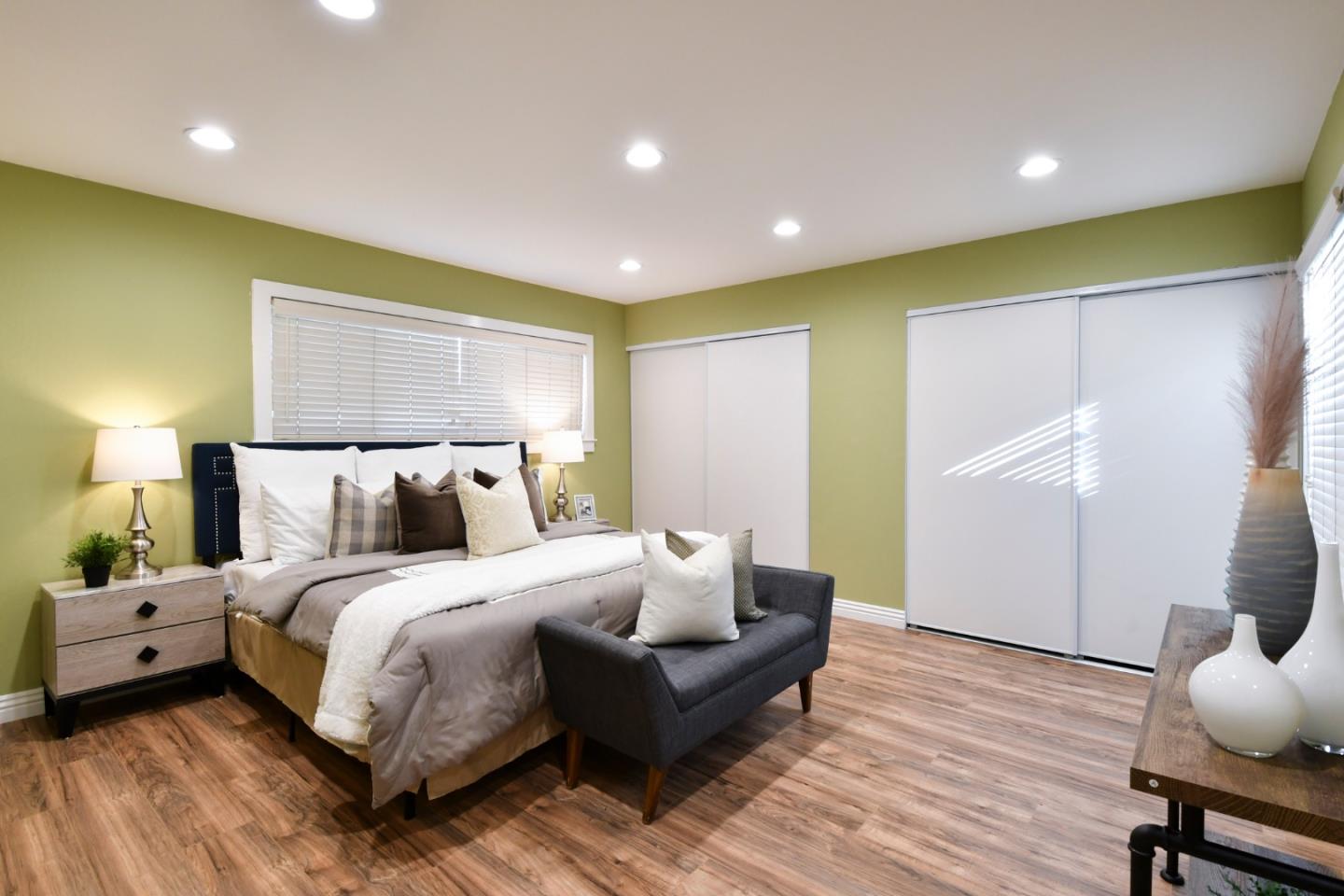 22059 McClellan Road Cupertino, CA 95014 - Photo 20 of 40 a spacious bedroom with a bed and wooden floor