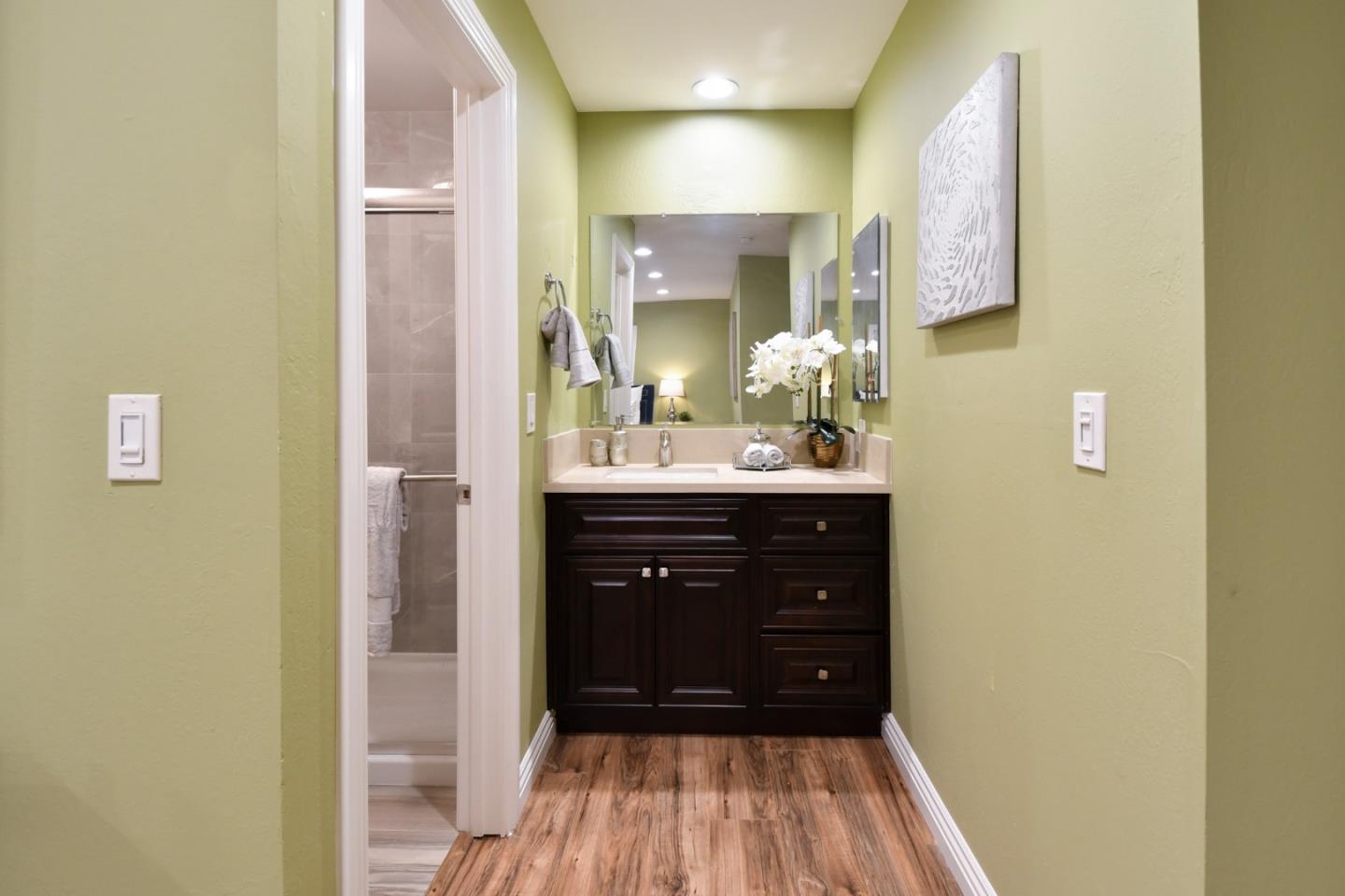 22059 McClellan Road Cupertino, CA 95014 - Photo 22 of 40 a bathroom with a sink and a mirror