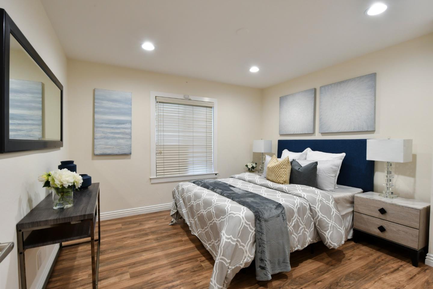 22059 McClellan Road Cupertino, CA 95014 - Photo 24 of 40 a bedroom with a bed and wooden floor