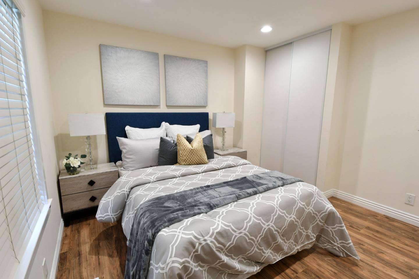 22059 McClellan Road Cupertino, CA 95014 - Photo 25 of 40 a bedroom with a bed and a window