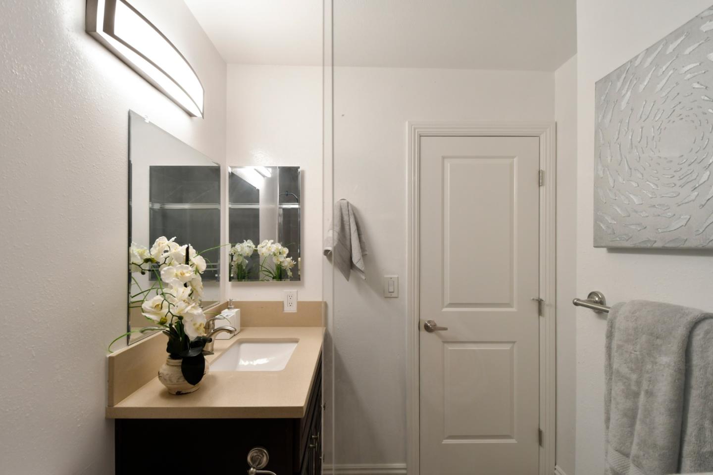 22059 McClellan Road Cupertino, CA 95014 - Photo 30 of 40 a bathroom with a sink a toilet and shower