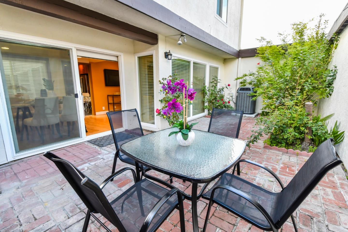 22059 McClellan Road Cupertino, CA 95014 - Photo 32 of 40 a view of a dining room with furniture and wooden floor