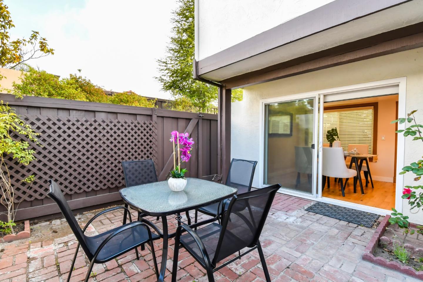 22059 McClellan Road Cupertino, CA 95014 - Photo 33 of 40 a backyard of a house with table and chairs