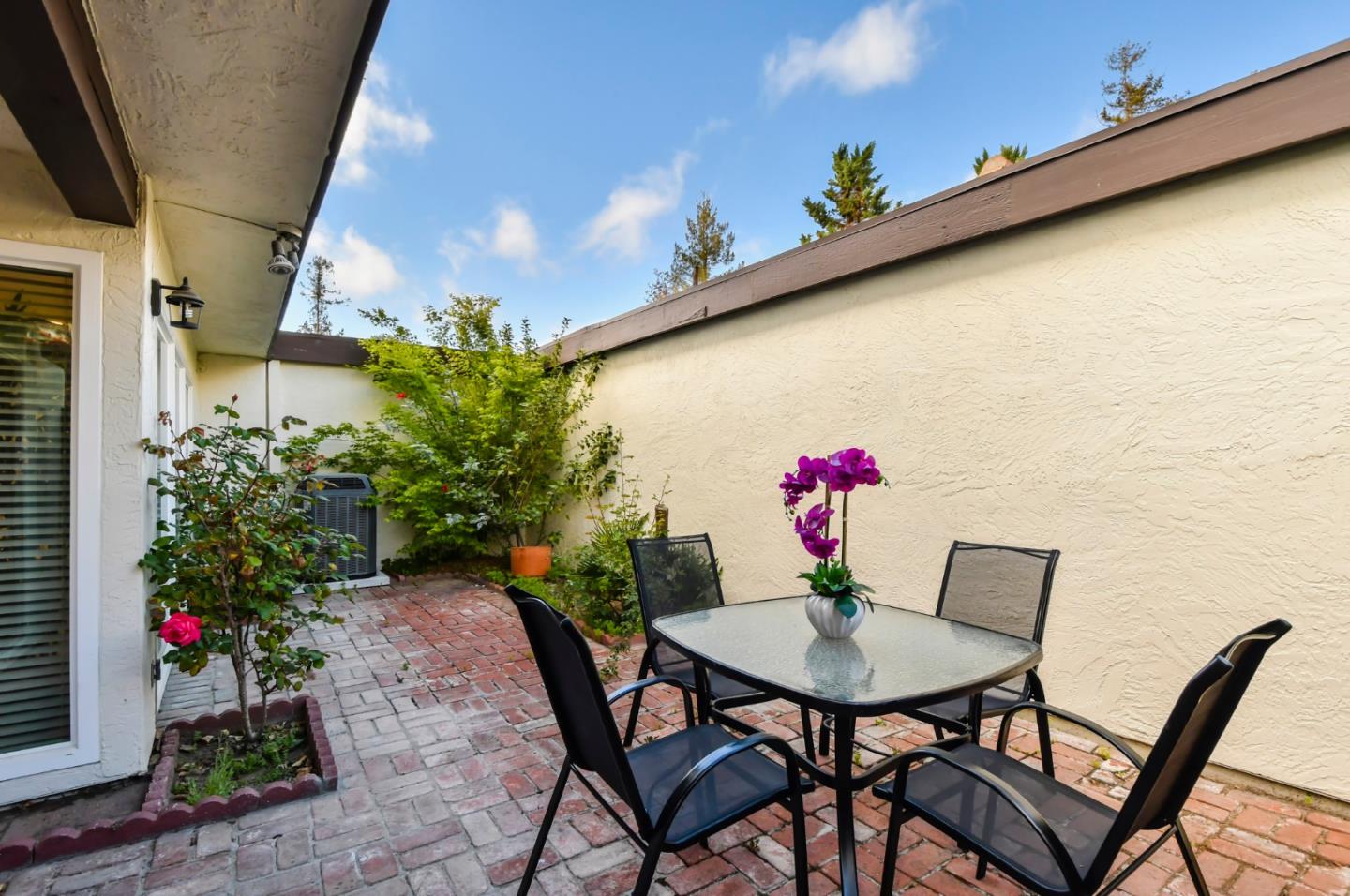 22059 McClellan Road Cupertino, CA 95014 - Photo 35 of 40 a table and chairs in front of a window