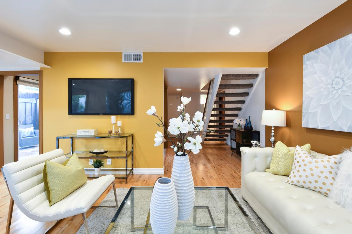 22059 McClellan Road Cupertino, CA 95014 - Photo 5 of 40 a living room with furniture and a flat screen tv