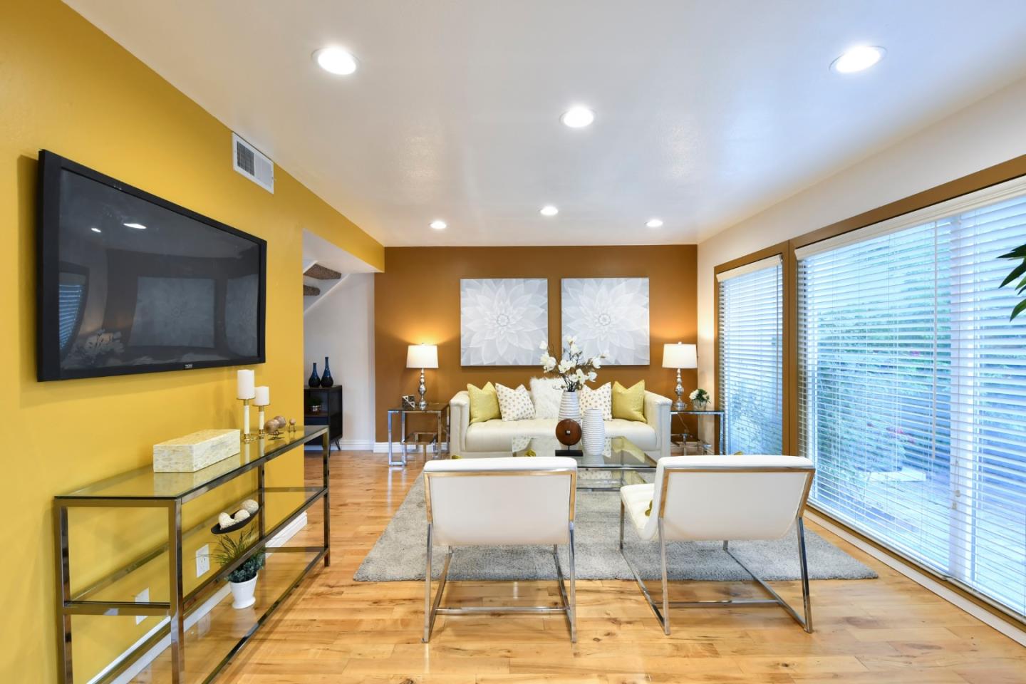 22059 McClellan Road Cupertino, CA 95014 - Photo 7 of 40 a living room with furniture and a flat screen tv