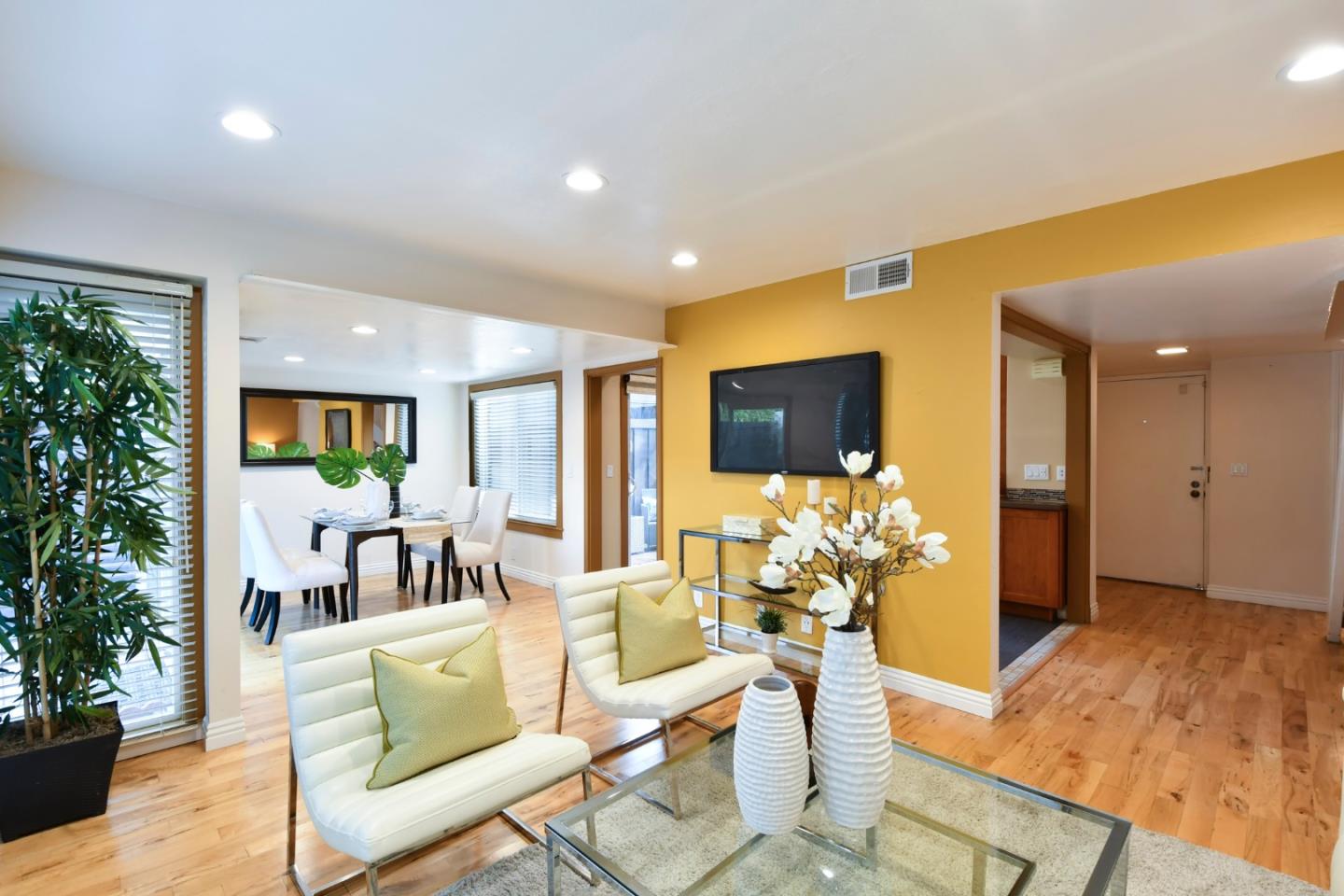 22059 McClellan Road Cupertino, CA 95014 - Photo 10 of 40 a living room with furniture and a large window