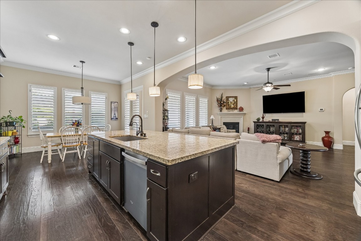 3 Tiburon Court Spring, TX 77389 - Photo 13 of 35 Kitchen feature a large island, granite countertops, and dark cabinetry.