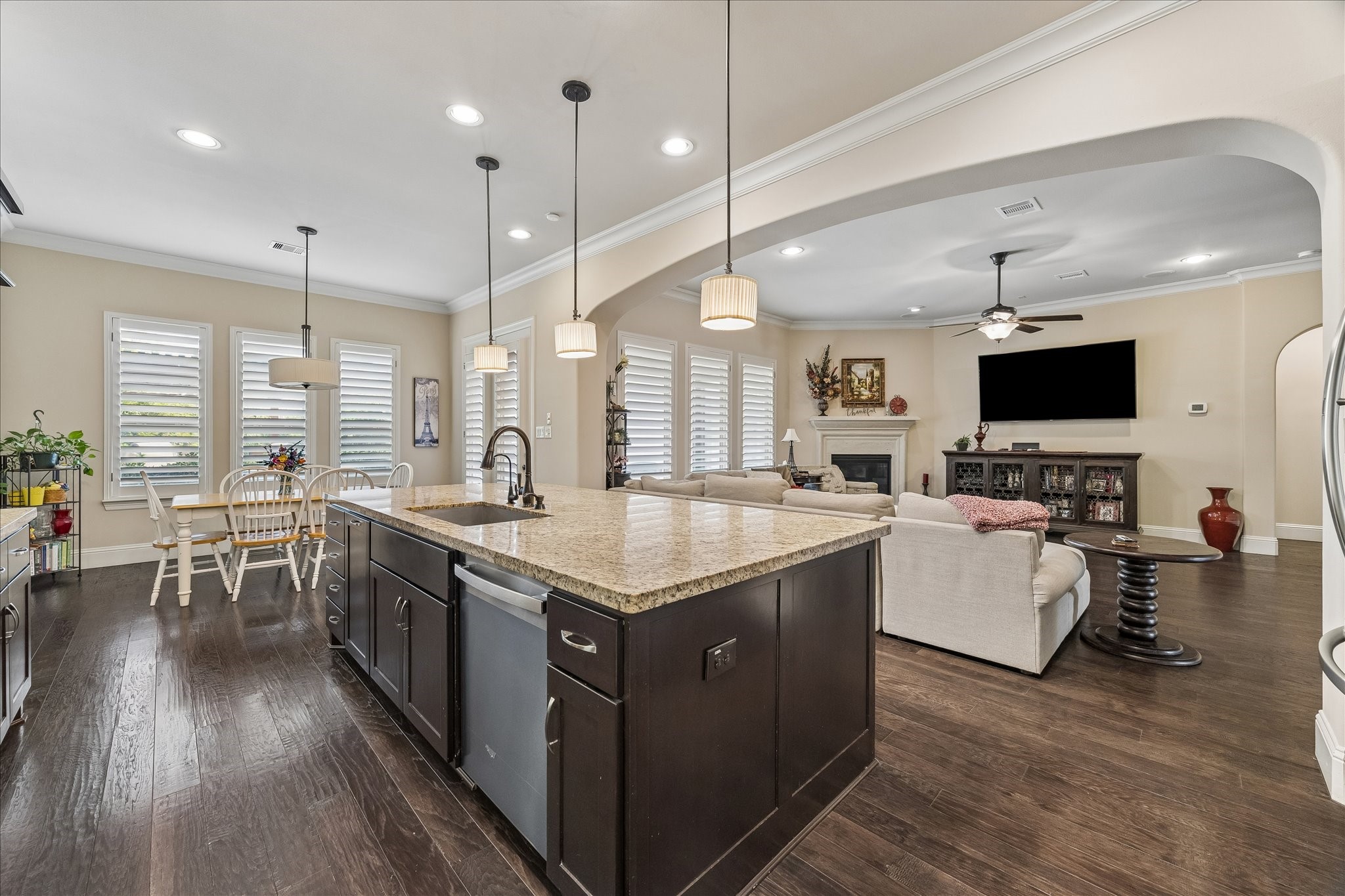 3 Tiburon Court Spring, TX 77389 - Photo 13 of 37 Kitchen feature a large island, granite countertops, and dark cabinetry.