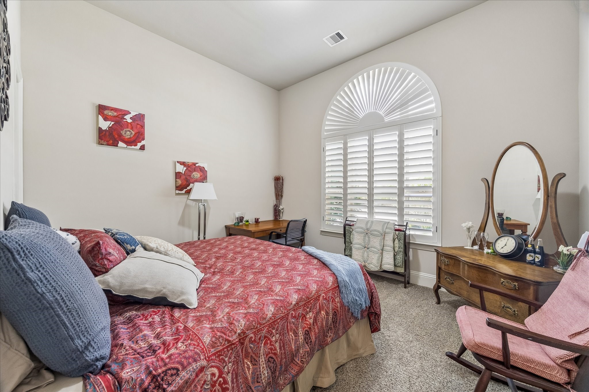 3 Tiburon Court Spring, TX 77389 - Photo 7 of 37 Cozy bedroom with a high ceiling and a large, arched window featuring plantation shutters found on the main floor.