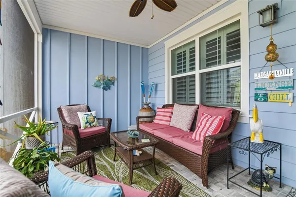 a outdoor living space with furniture and a potted plant
