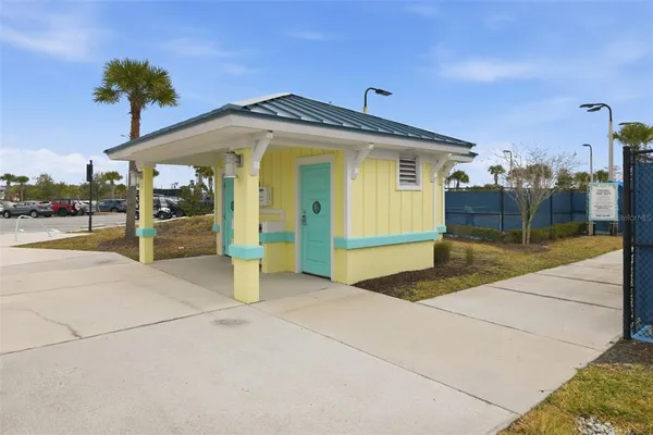 a yellow house with a outdoor space