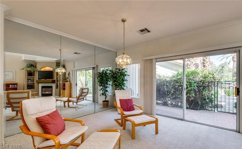 5272 Island Chain Road Las Vegas, NV 89118 - Photo 30 of 31 Natural light streams into this airy living space with a charming fireplace and patio access.