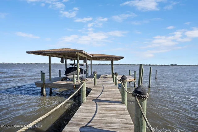 a view of a chairs and table on the wooden floor
