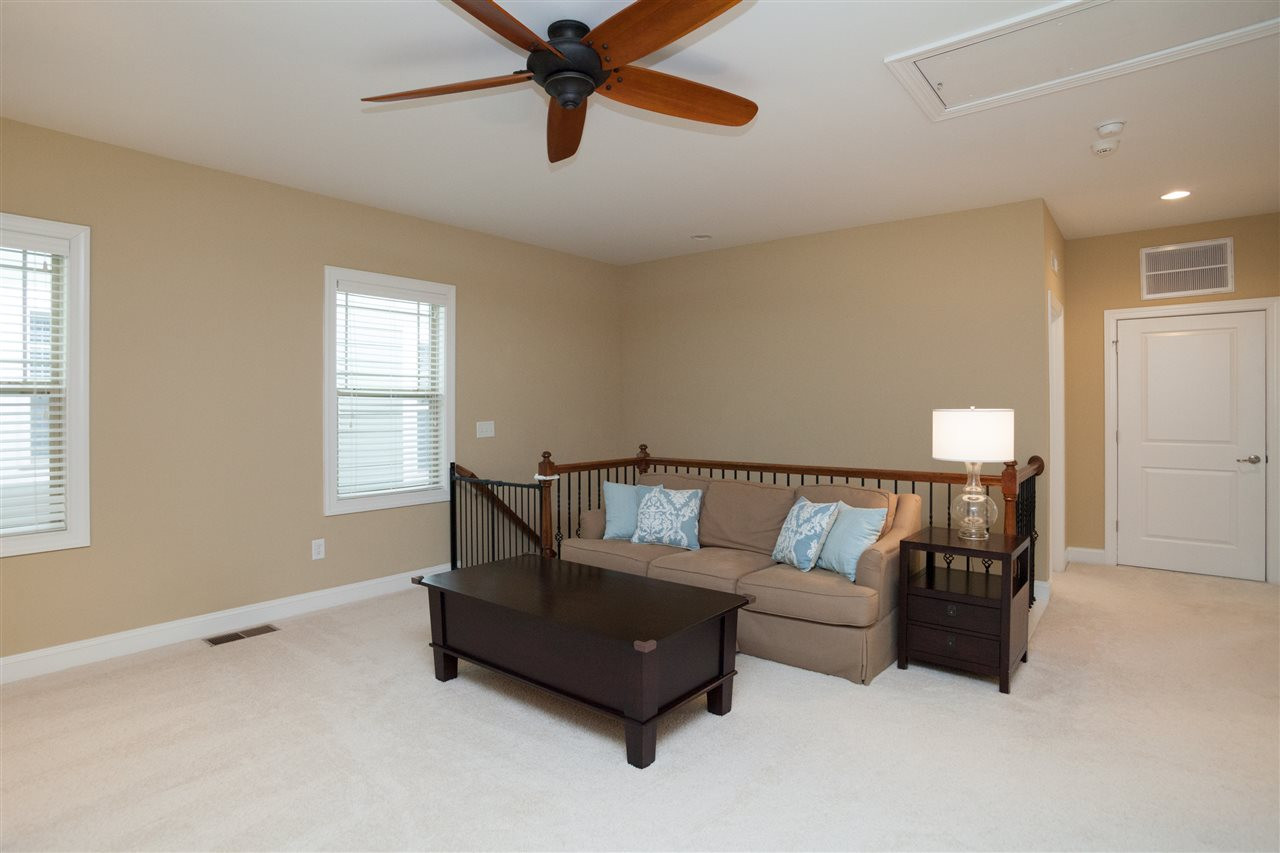 1410 Van Page Boulevard Raleigh, NC 27607 - Photo 17 of 25 WROUGHT IRON SPINDLES GREET YOU ON THE HARDWOOD STEPS AND LEAD YOU INTO THE OPEN LOFT AREA AND ALL THREE UPSTAIRS BEDROOMS! Bonus Room