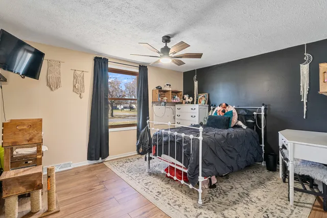 a bed room with furniture and a chandelier
