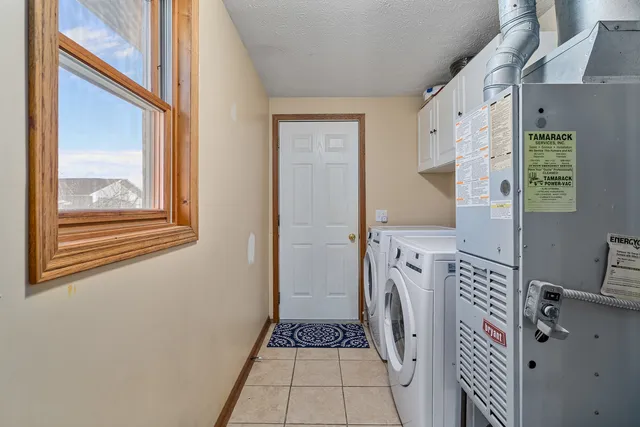 a view of a hallway with washer and dryer