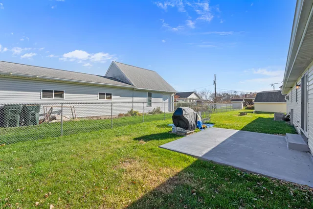 a view of a backyard with a garden and plants