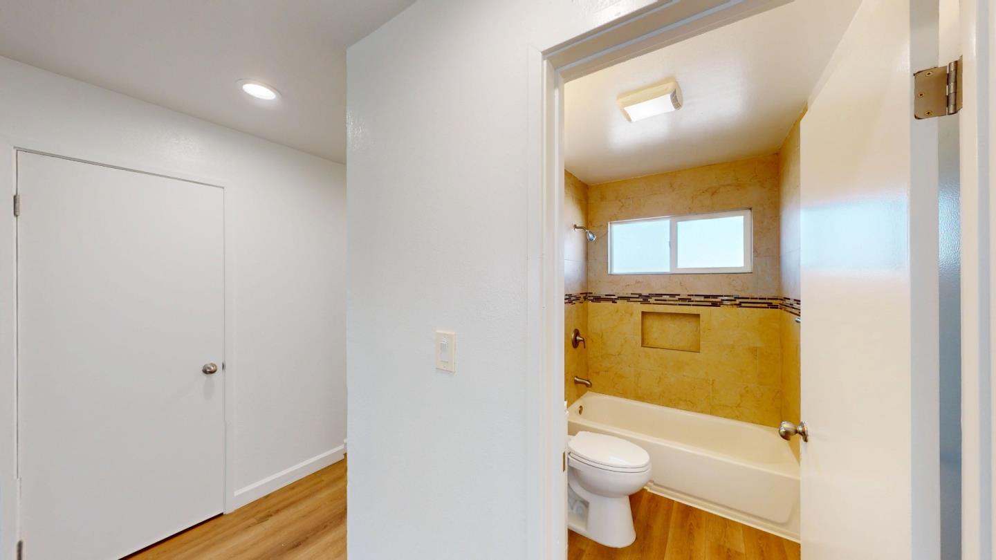 19 Merrydale Road San Rafael, CA 94903 - Photo 12 of 13 a bathroom with a granite countertop toilet and a sink