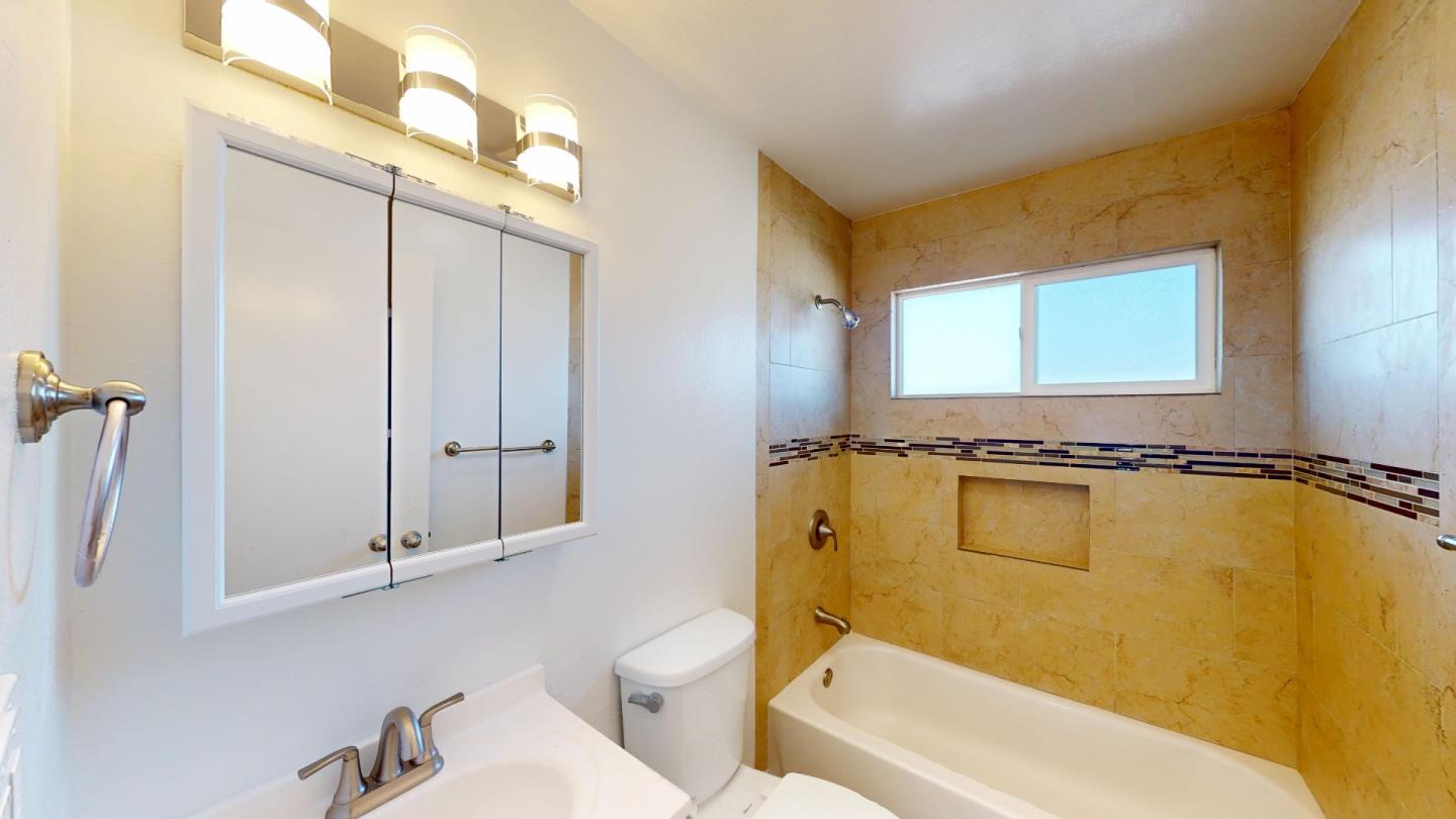 19 Merrydale Road San Rafael, CA 94903 - Photo 13 of 13 a bathroom with a granite countertop sink and a mirror