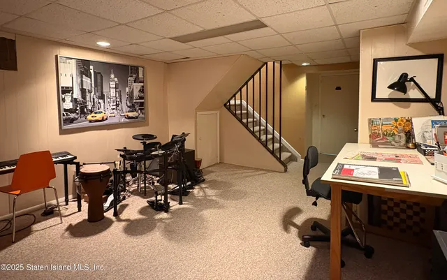 a room with furniture and gym equipment