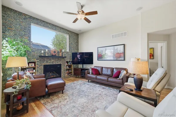 a living room with furniture and a fireplace